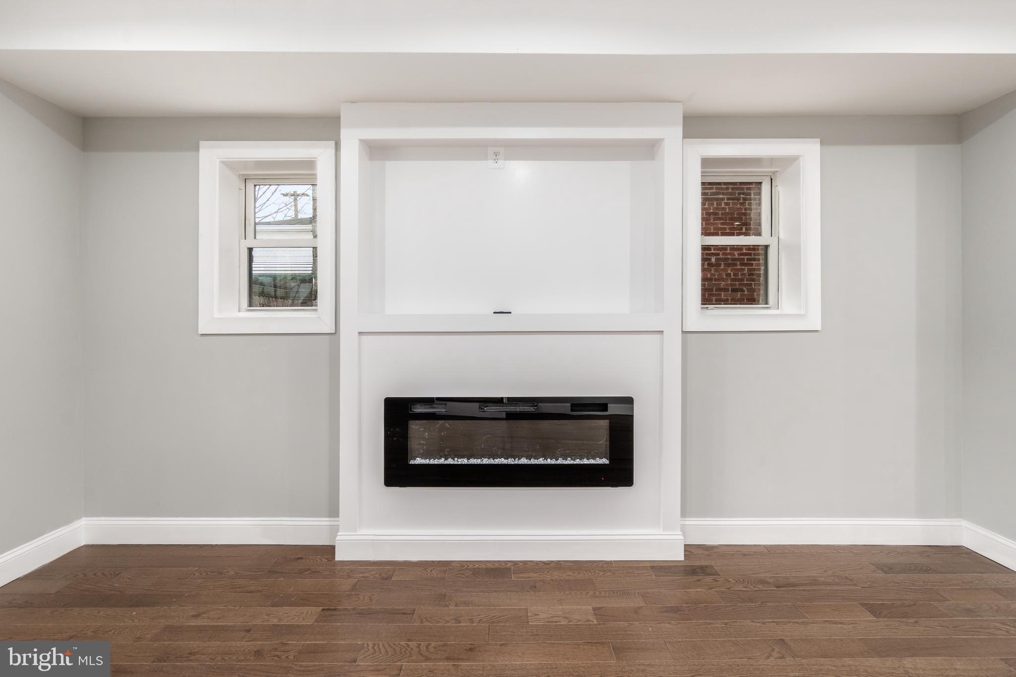 928 Perry Place Northeast Washington, DC 20017 - Photo 8 of 36 a living room with a fireplace