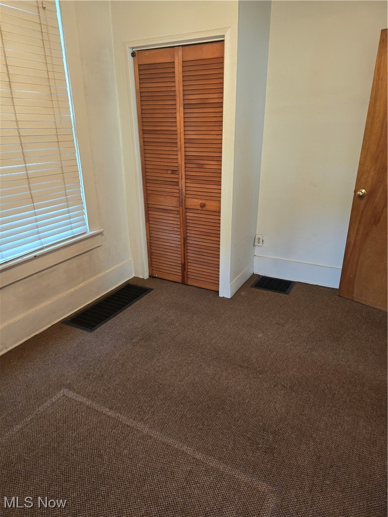 7968 River Styx Road Medina, OH 44256 - Photo 7 of 27 Unfurnished bedroom featuring a closet and carpet