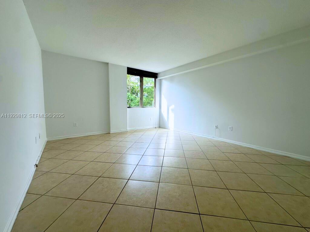 2630 Southwest 28th Street, Unit 44 Miami, FL 33133 - Photo 11 of 12 a view of an empty room with a window