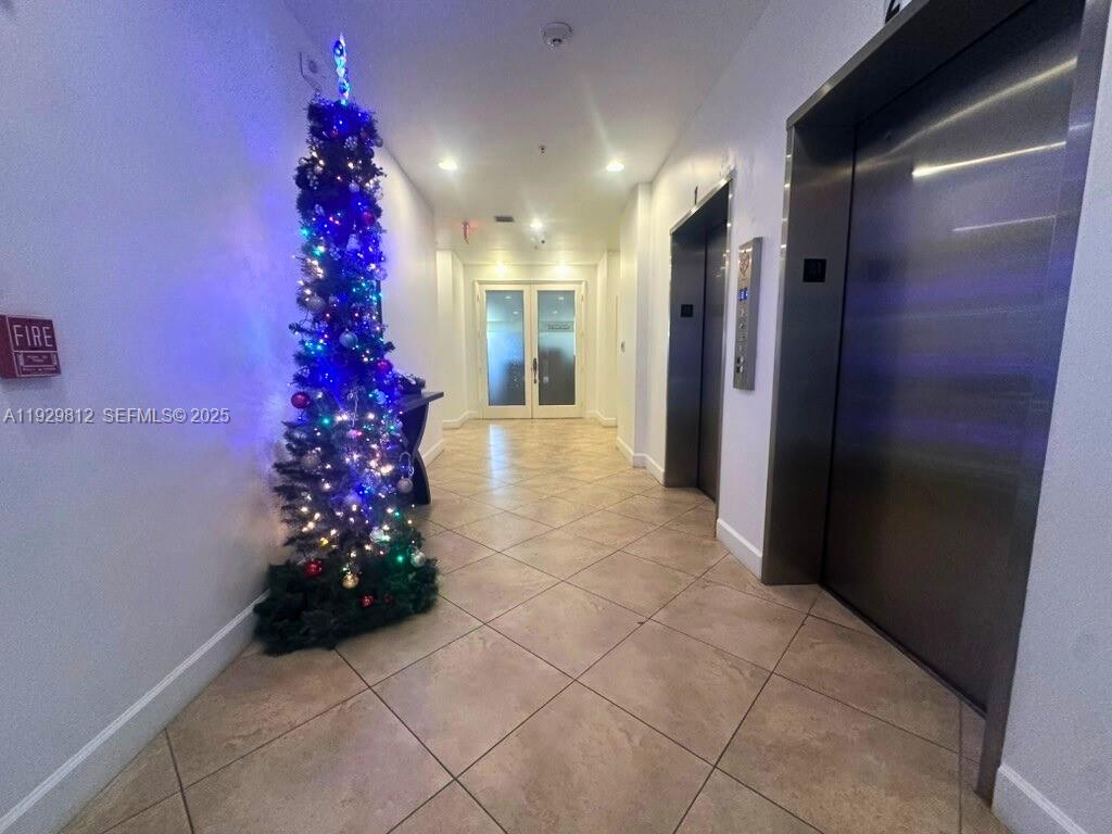 2630 Southwest 28th Street, Unit 44 Miami, FL 33133 - Photo 3 of 12 a beautiful room with flower and flowers