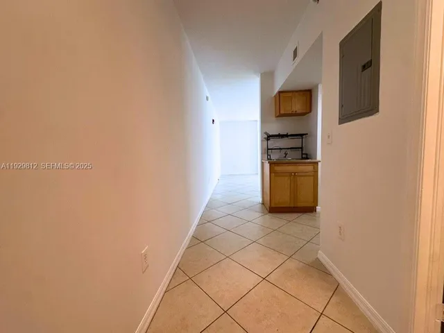 a kitchen with stainless steel appliances a refrigerator and microwave