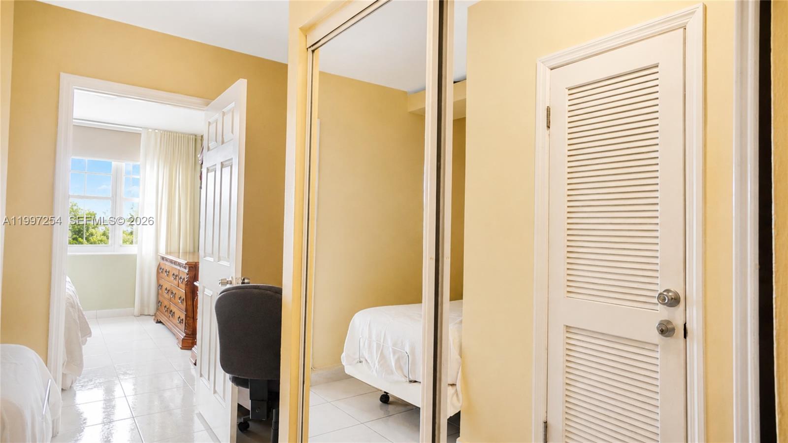 100 Lincoln Road, Unit 422 Miami Beach, FL 33139 - Photo 12 of 23 a en suite bathroom with a sink and a mirror