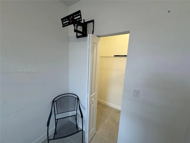 a kitchen with granite countertop a refrigerator and a stove