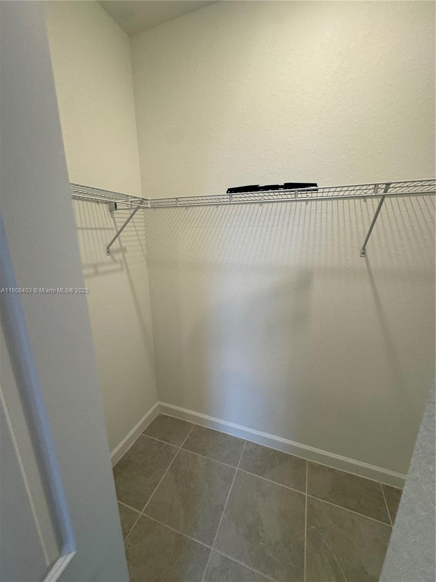 28850 Southwest 163rd Avenue, Unit 2 Homestead, FL 33033 - Photo 12 of 16 a view of a room with racks on the wall