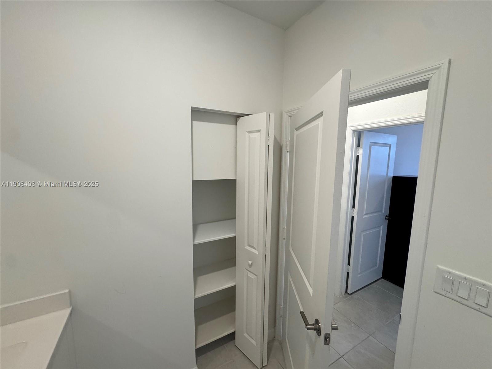 28850 Southwest 163rd Avenue, Unit 2 Homestead, FL 33033 - Photo 5 of 16 a view of closet area