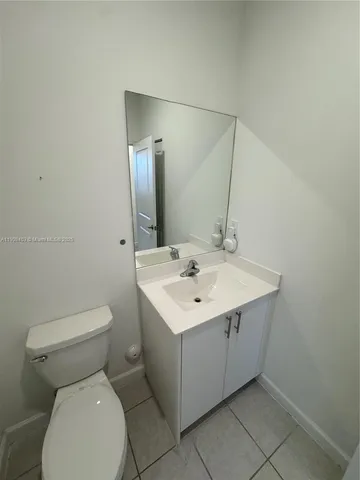 a picture of a bathroom with a sink and a mirror
