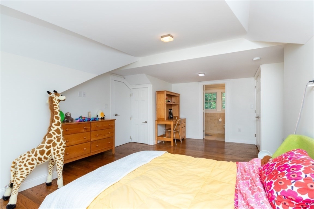 15 Giles Road Lincoln, MA 01773 - Photo 13 of 22 a bedroom with furniture and a bed