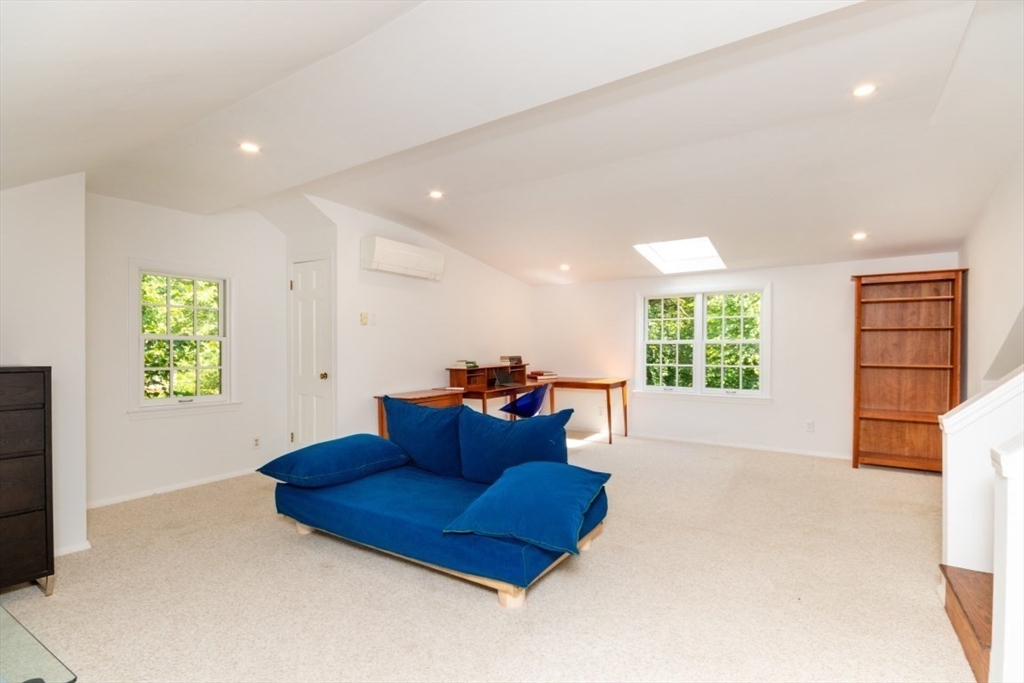 15 Giles Road Lincoln, MA 01773 - Photo 17 of 22 a living room with furniture and a window