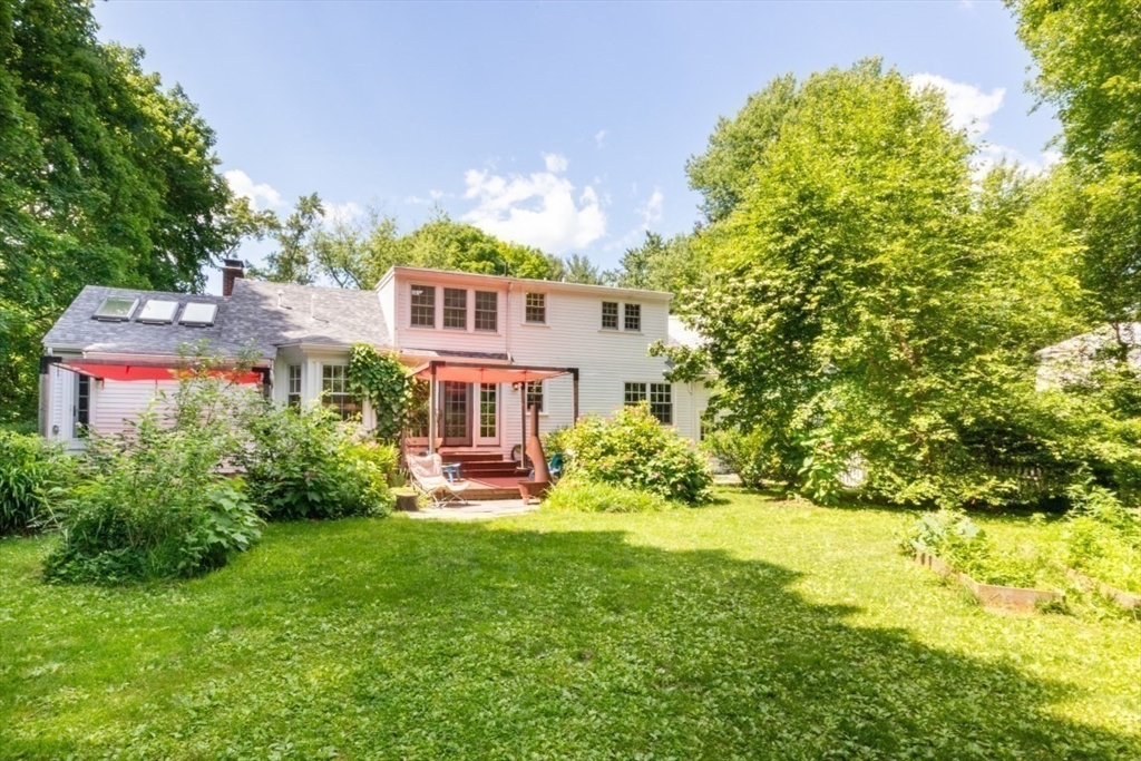 15 Giles Road Lincoln, MA 01773 - Photo 3 of 22 a front view of a house with a yard