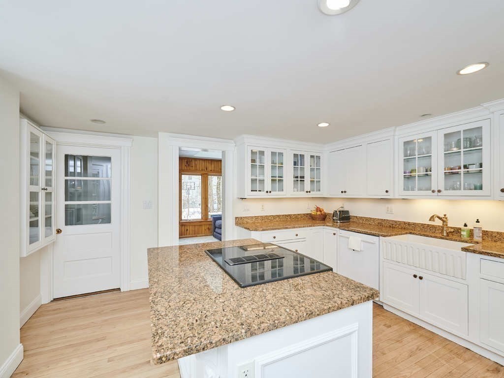 15 Giles Road Lincoln, MA 01773 - Photo 6 of 22 a large kitchen with granite countertop a sink and dishwasher with wooden floor
