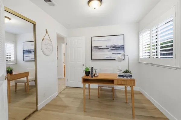 a living room with furniture and a table