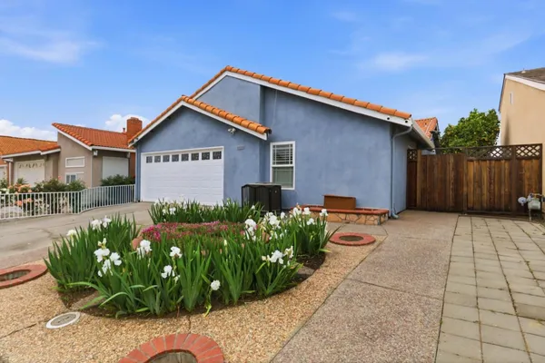 a front view of a house with garden