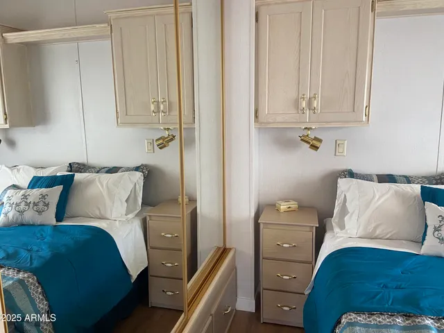 a bedroom with a bed and a closet