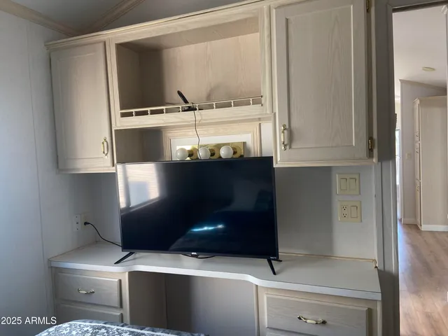 a kitchen with a refrigerator and a cabinets