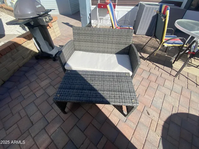 a view of a house with backyard and wooden floor
