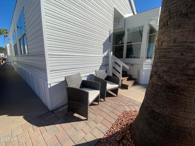 a terrace of a house with outdoor seating