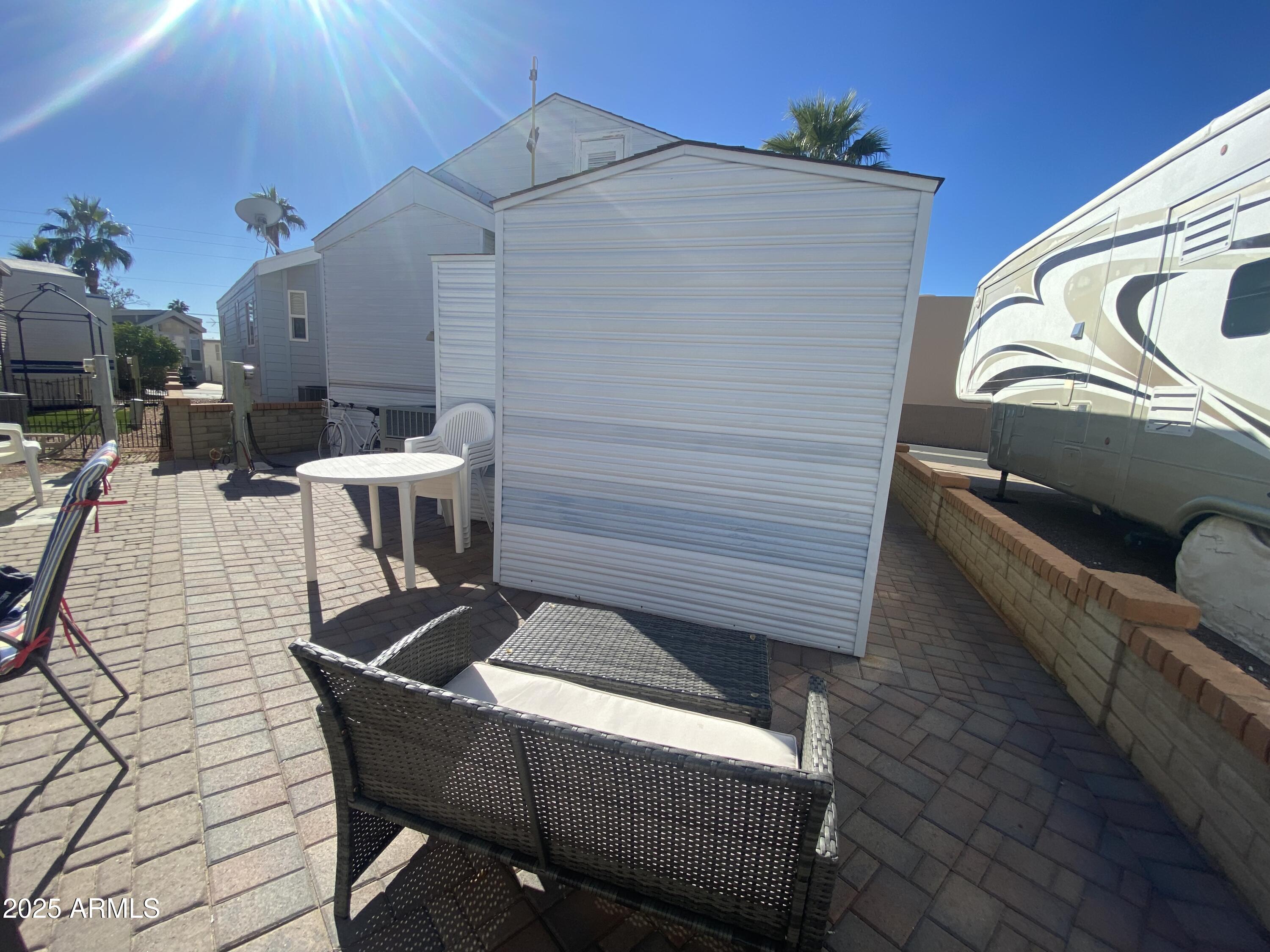 2128 South Dakota Avenue Apache Junction, AZ 85119 - Photo 36 of 36 a terrace of a house with outdoor seating