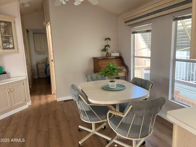 a view of a dining room with furniture window and wooden floor