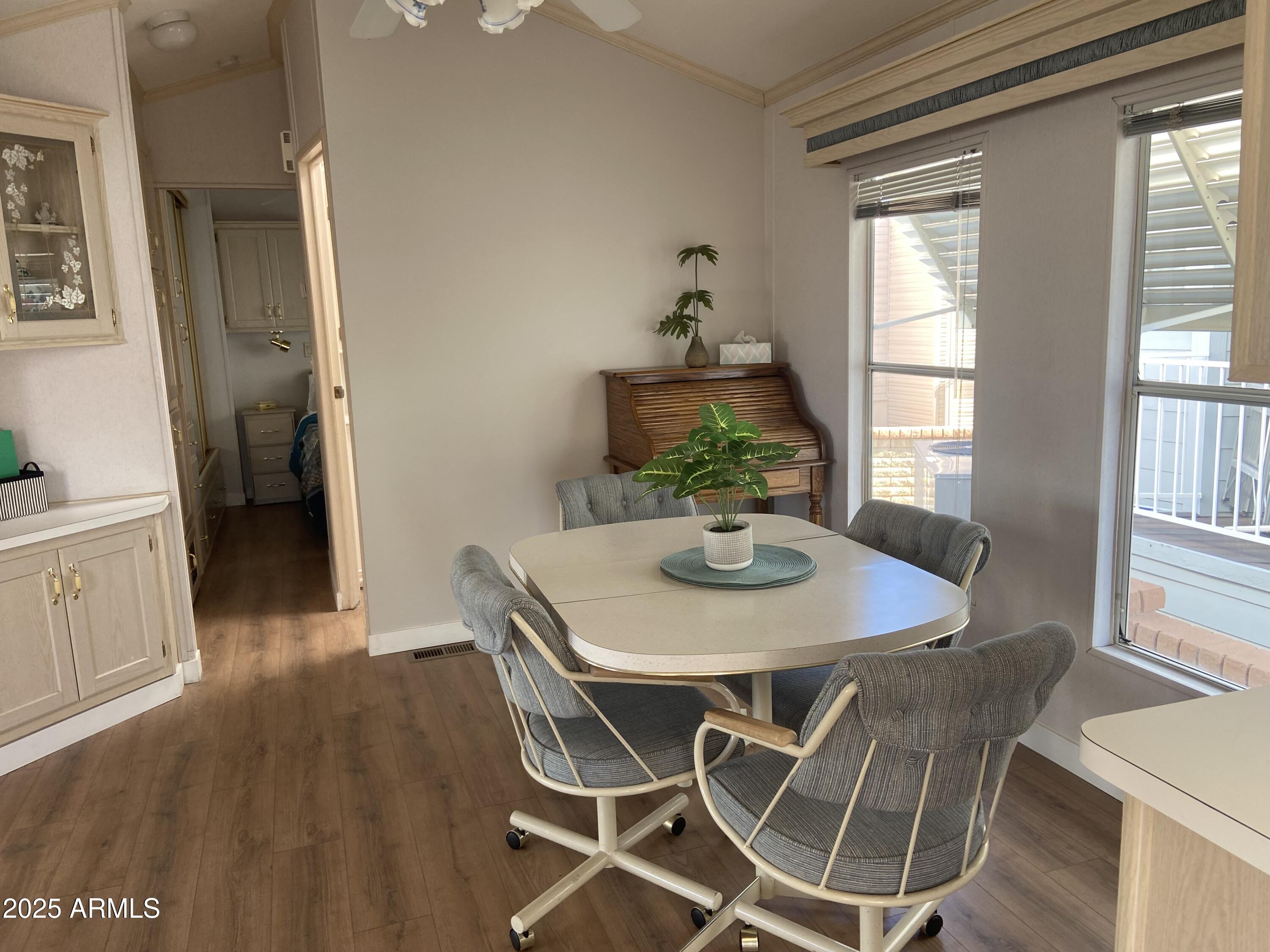 2128 South Dakota Avenue Apache Junction, AZ 85119 - Photo 6 of 36 a view of a dining room with furniture window and wooden floor