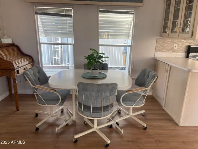 a dining room with furniture and windows
