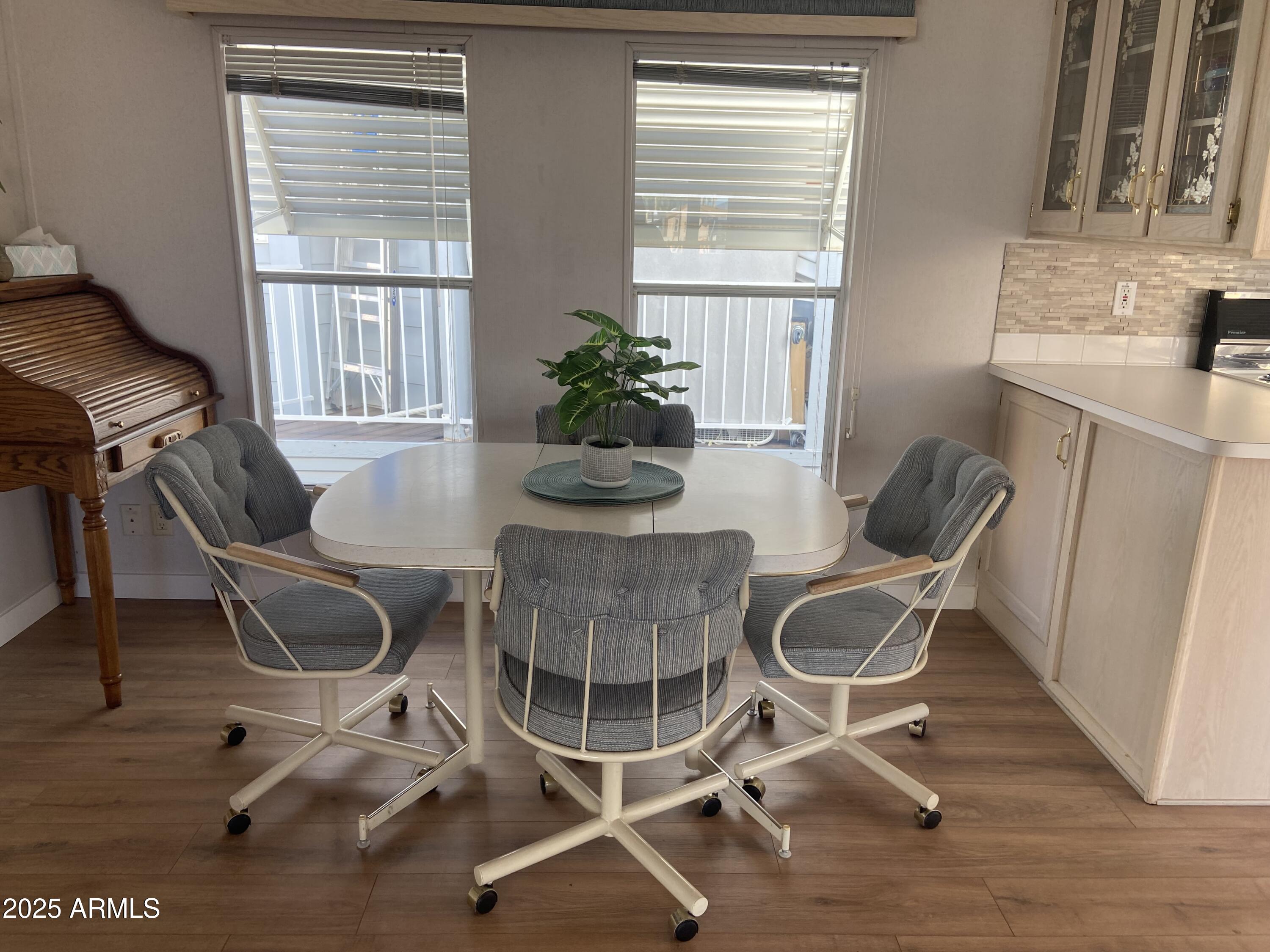 2128 South Dakota Avenue Apache Junction, AZ 85119 - Photo 7 of 36 a dining room with furniture and windows