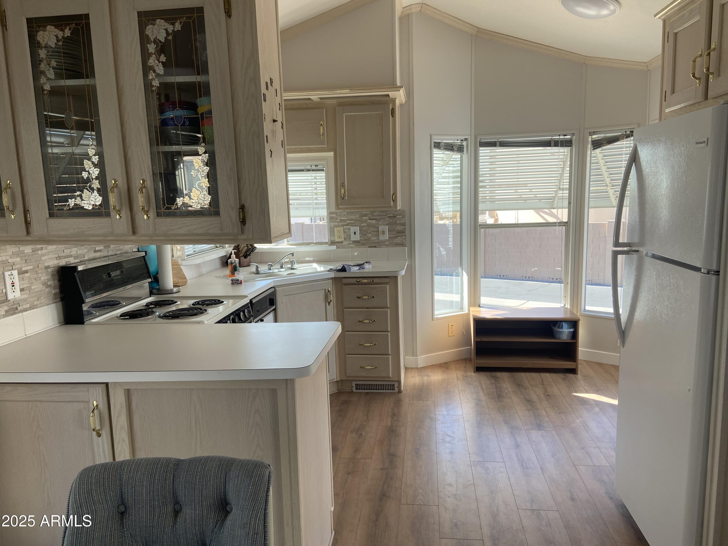 2128 South Dakota Avenue Apache Junction, AZ 85119 - Photo 9 of 36 a kitchen with a sink appliances and cabinets