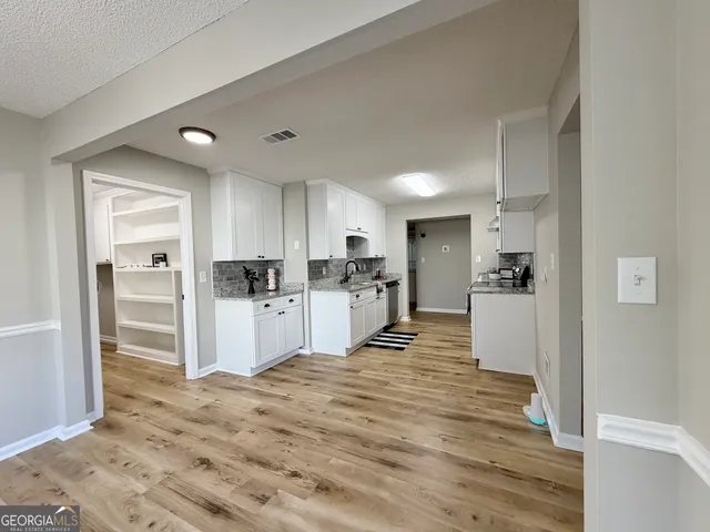 a view of kitchen with wooden floor