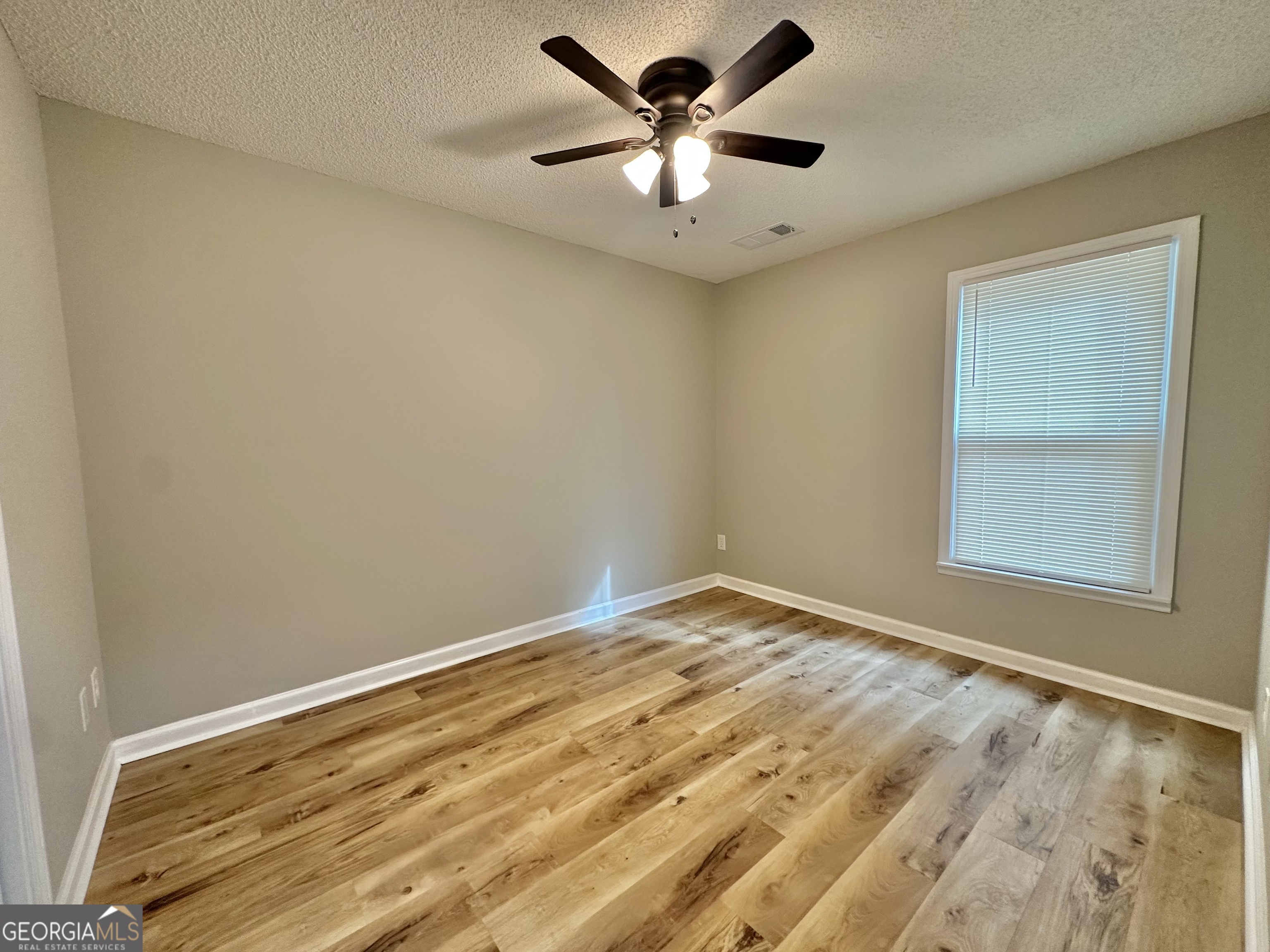 1610 Lance Drive Dublin, GA 31021 - Photo 22 of 46 a view of an empty room with a window