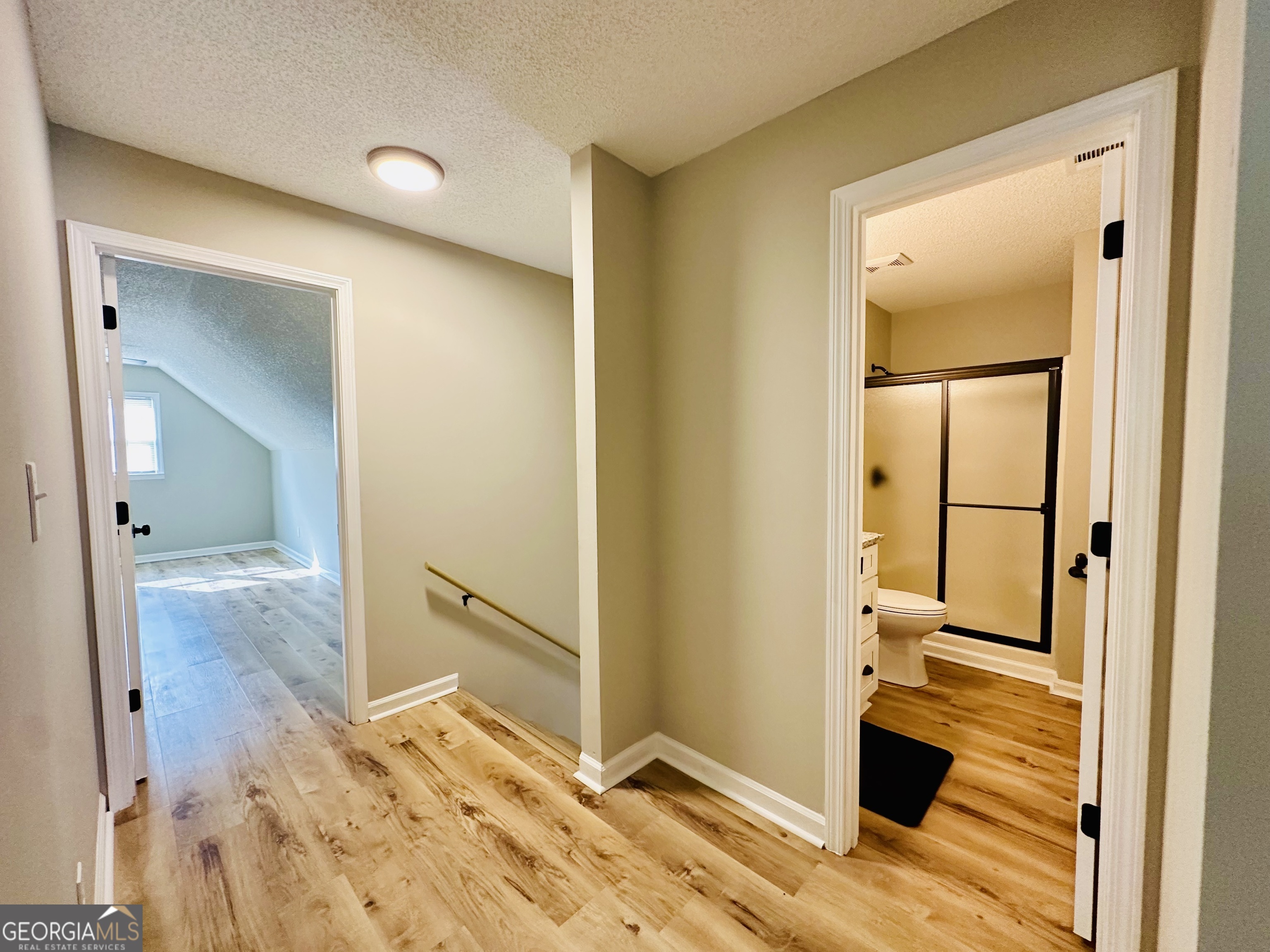 1610 Lance Drive Dublin, GA 31021 - Photo 26 of 46 wooden floor with a view of bathroom