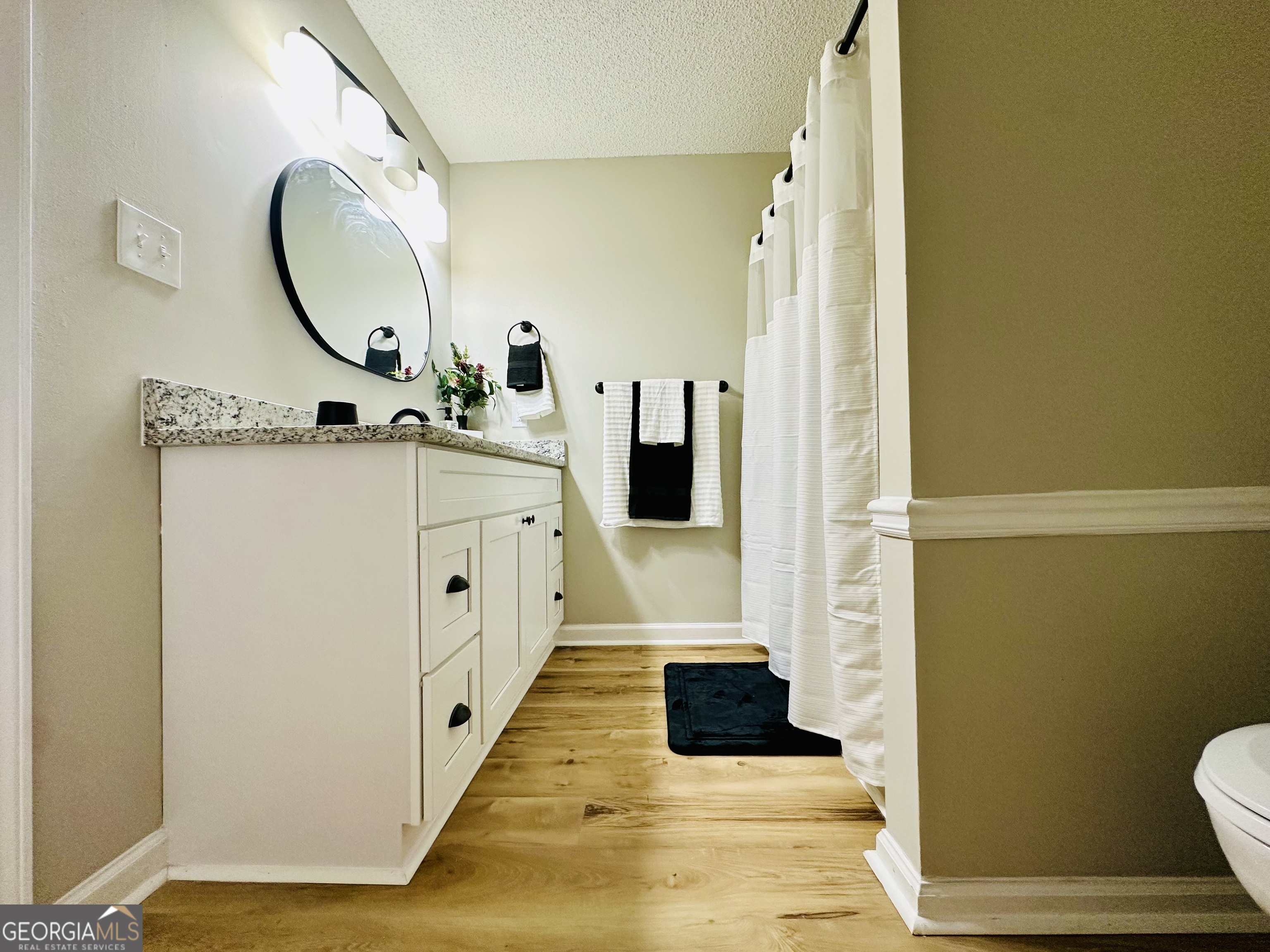1610 Lance Drive Dublin, GA 31021 - Photo 27 of 46 a bathroom with a sink and a mirror