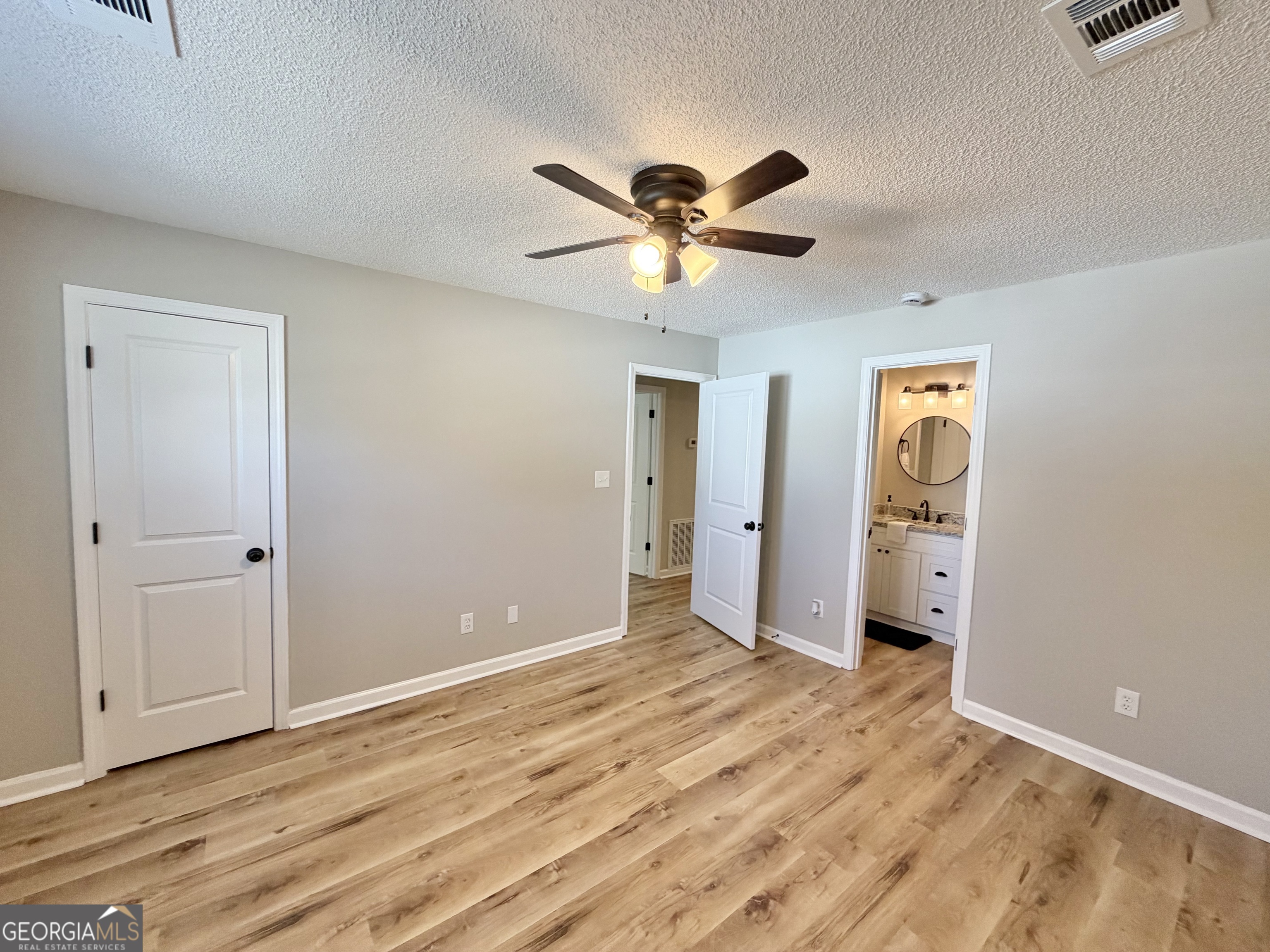 1610 Lance Drive Dublin, GA 31021 - Photo 35 of 46 a view of empty room with window and ceiling fan
