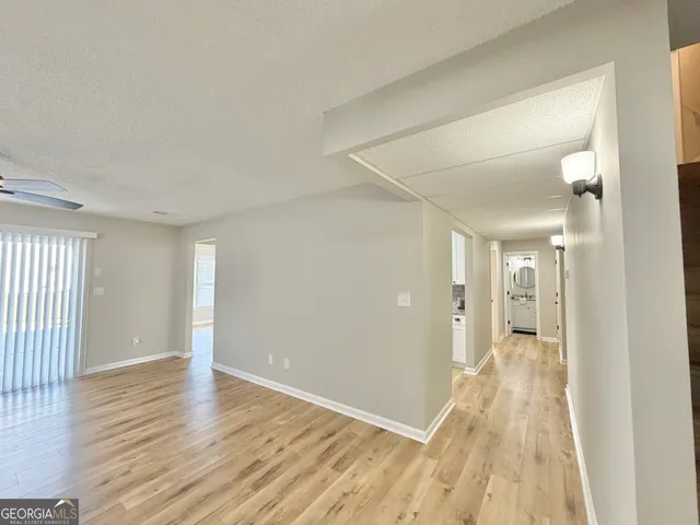 wooden floor in a hall with an entryway