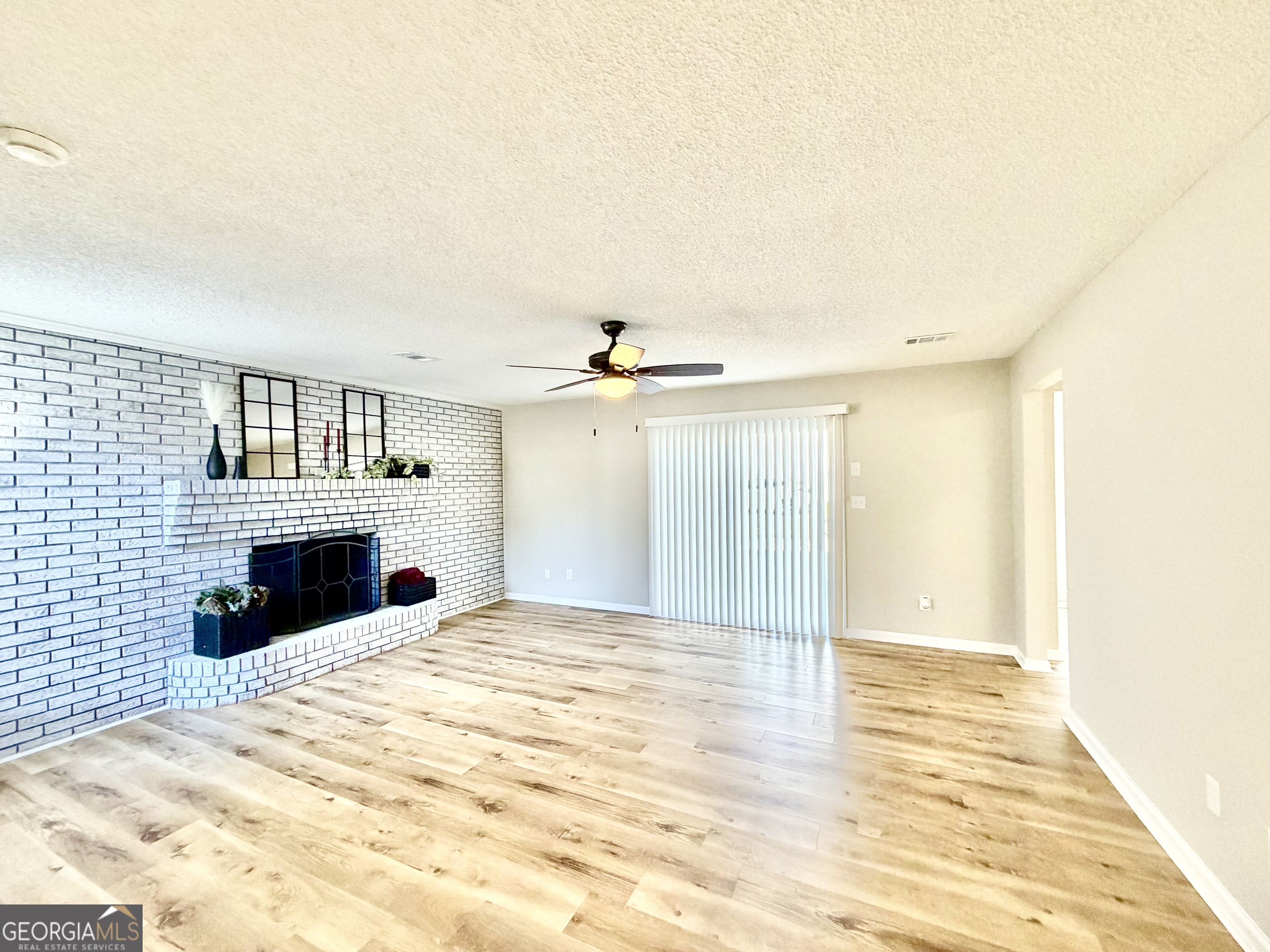 1610 Lance Drive Dublin, GA 31021 - Photo 10 of 46 a view of a livingroom with a fireplace