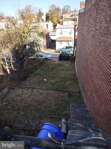 a view of a balcony with wooden floor
