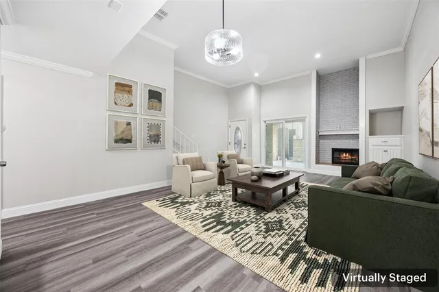 a living room with furniture a fireplace and a table