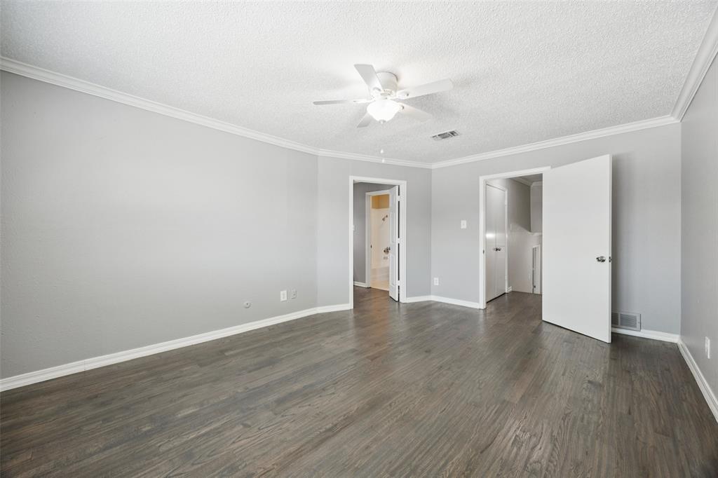 207 East Harwood Road, Unit 14 Euless, TX 76039 - Photo 17 of 28 a view of an empty room with wooden floor