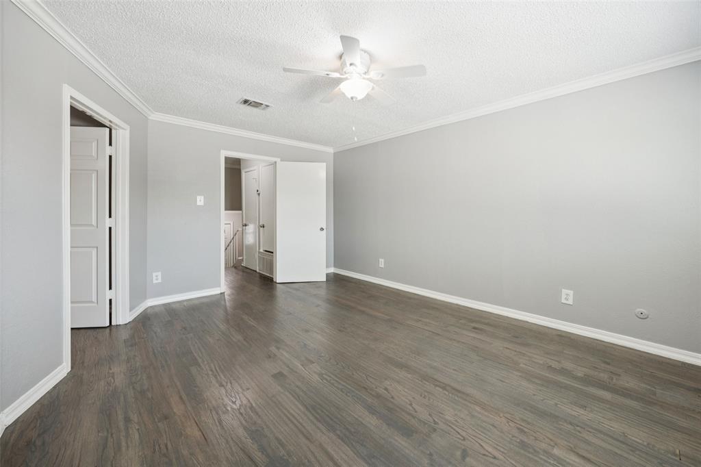 207 East Harwood Road, Unit 14 Euless, TX 76039 - Photo 18 of 28 a view of an empty room with wooden floor