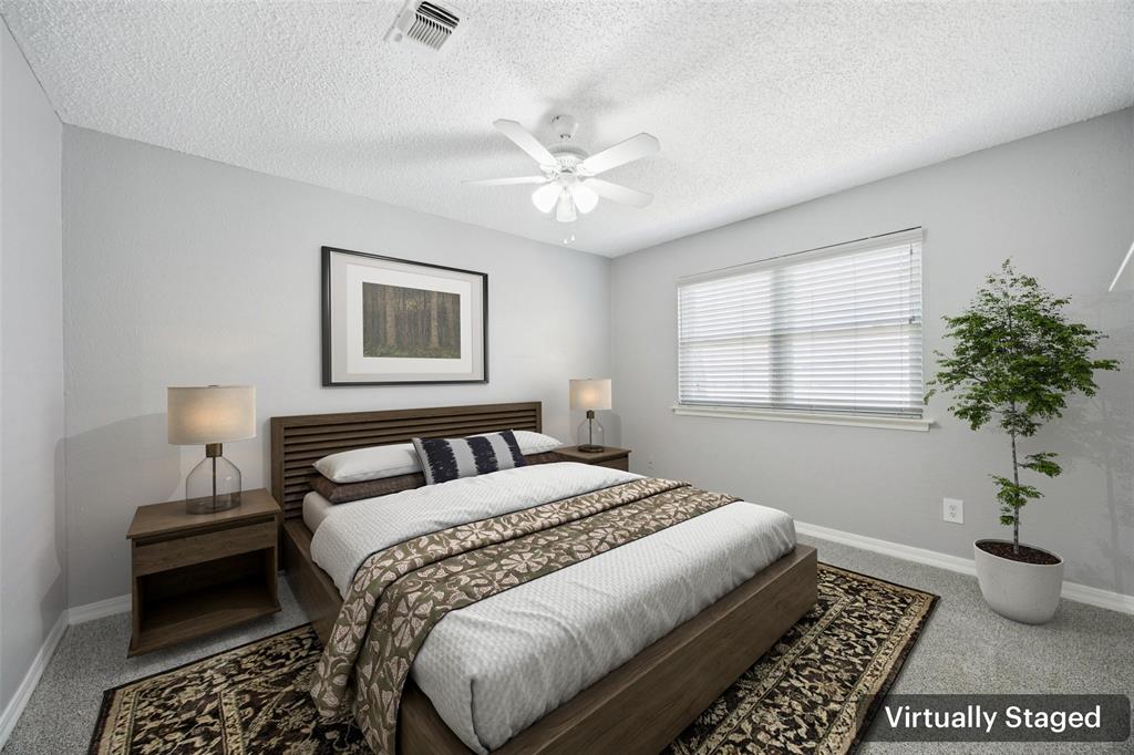 207 East Harwood Road, Unit 14 Euless, TX 76039 - Photo 23 of 28 a bedroom with furniture and a window