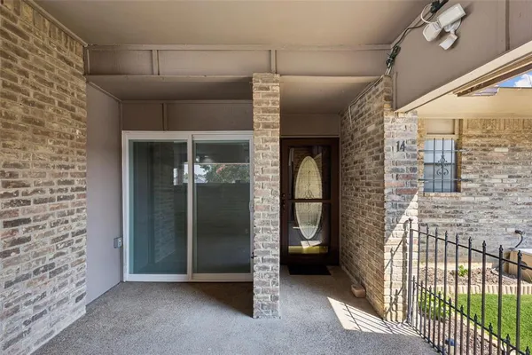 a view of a hallway with wooden walls