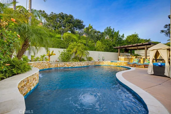 a view of a swimming pool with a patio