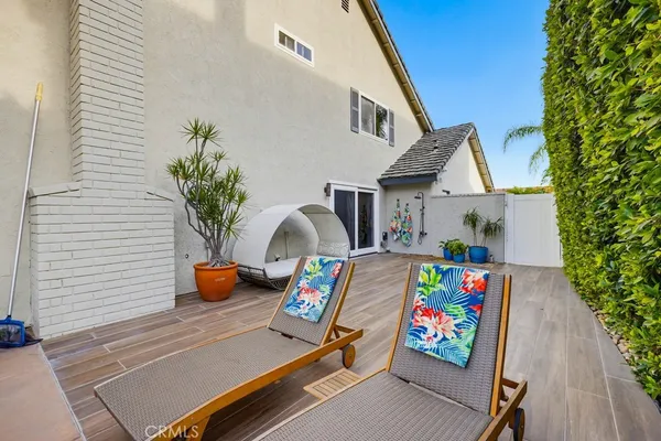 a view of an outdoor space with furniture and umbrella