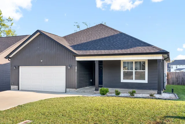 a front view of a house with garden