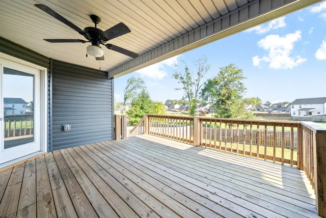 a view of a balcony with wooden floor