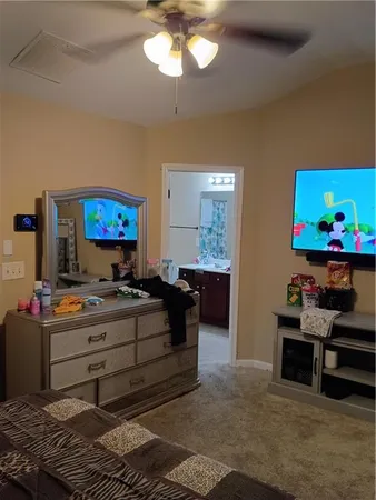 a bedroom with furniture and a bed
