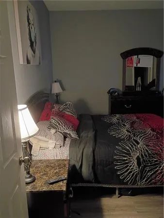 a bed sitting in a bedroom next to a fireplace