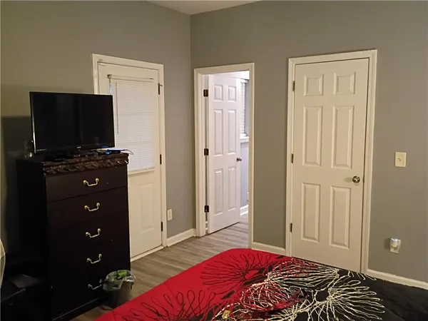 a bedroom with a bed and television