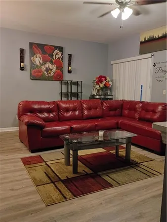 a living room with furniture and a rug