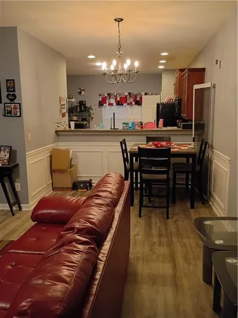 a living room with kitchen furniture and a kitchen