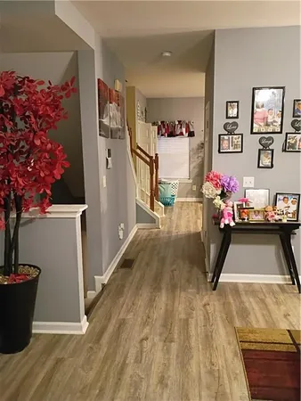 a room with wooden floor and furniture