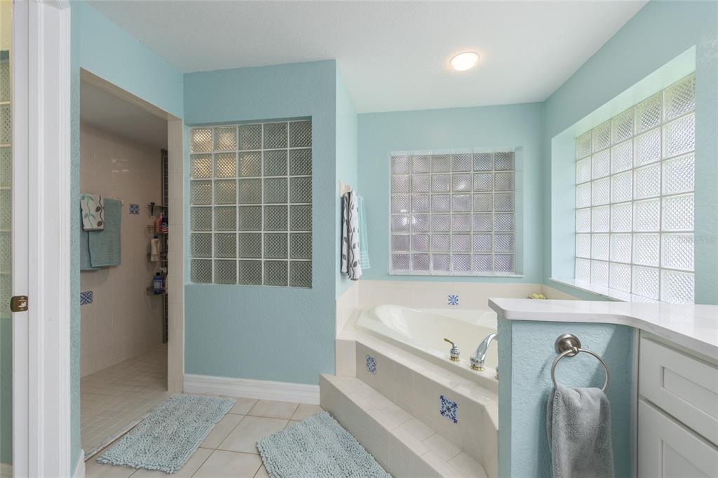 18825 Southwest 93rd Loop Dunnellon, FL 34432 - Photo 43 of 85 a bathroom with a tub sink and shower